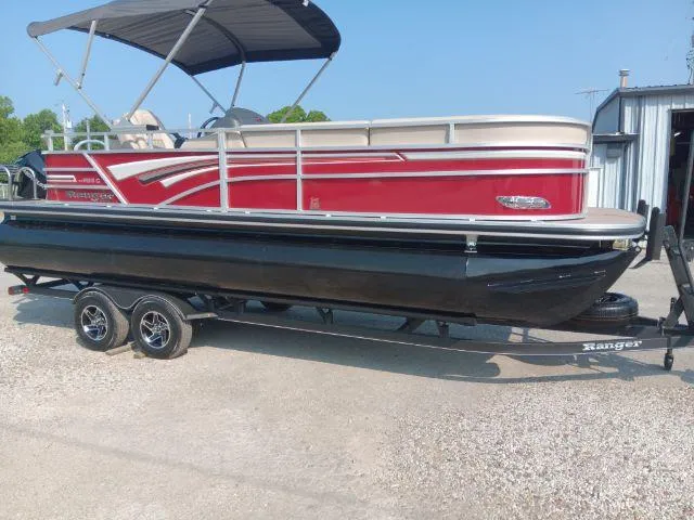 Slide: The Image of 2023 Ranger Reata 223C pontoon boat on trailer, red and black design. - 38