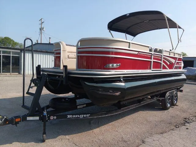 Slide: The Image of 2023 Ranger Reata 223C pontoon boat on trailer, featuring red and beige design. - 5