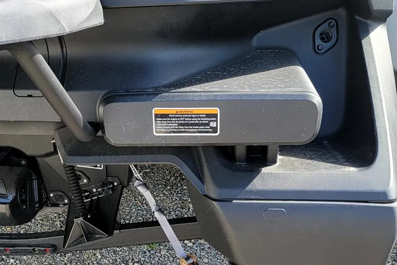 Slide: The Image of 2023 Sea-Doo Switch Sport 21 close-up of control panel and warning label. - 11