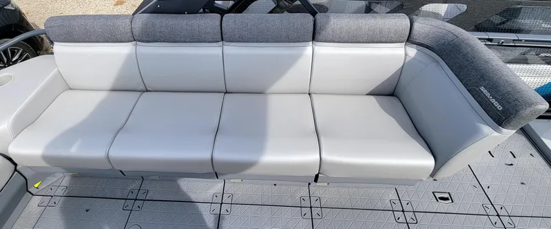 Slide: The Image of 2023 Sea-Doo Switch Sport 21 boat seating area with gray upholstery. - 4