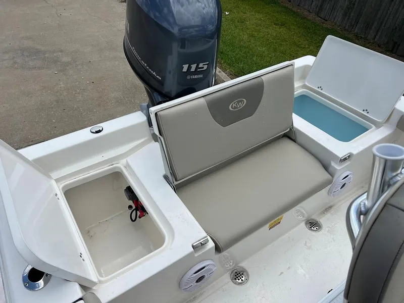Slide: The Image of 2024 Key West 179 FS boat with Yamaha 115 engine, open storage compartments. - 10