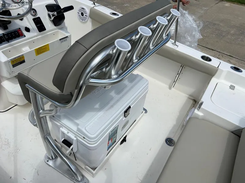 Slide: The Image of 2024 Key West 179 FS boat interior with rod holders and cooler. - 11