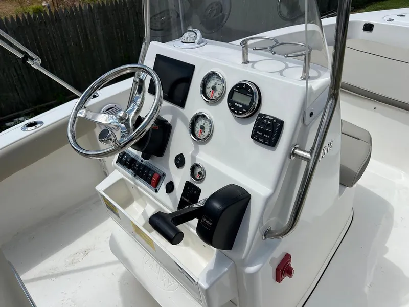 Slide: The Image of 2024 Key West 179 FS boat console with steering wheel and gauges. - 13