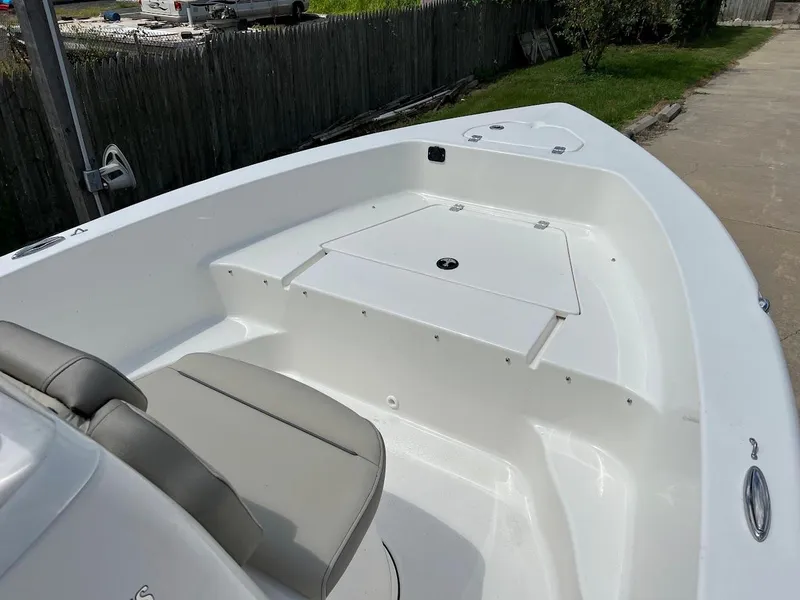 Slide: The Image of 2024 Key West 179 FS boat interior with seating and storage compartments. - 18