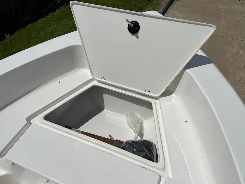 Slide: The Image of 2024 Key West 179 FS boat storage compartment with open hatch. - 21