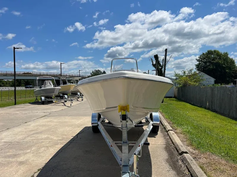 Slide: The Image of 2024 Key West 179 FS boat on a trailer, parked outdoors on a sunny day. - 4