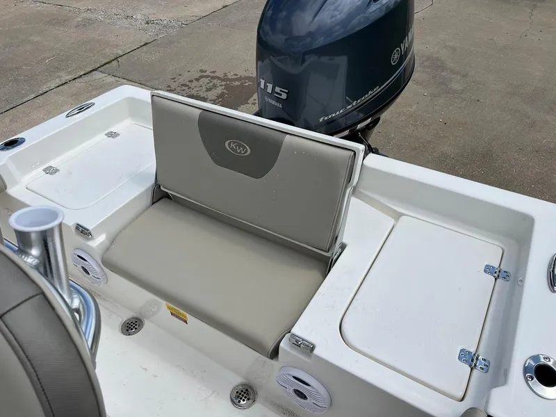 Slide: The Image of 2024 Key West 179 FS boat with Yamaha 115 engine, rear seating and storage compartments. - 9
