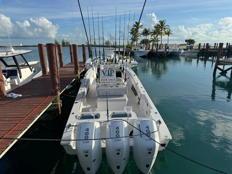 Slide: The Image of 2024 Fountain 38 Tournament Edition boat docked, equipped with triple 400 engines, for sale. - 1
