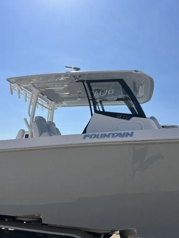 Slide: The Image of 2024 Fountain 38 TE boat under clear blue sky, showcasing sleek design and modern features. - 12
