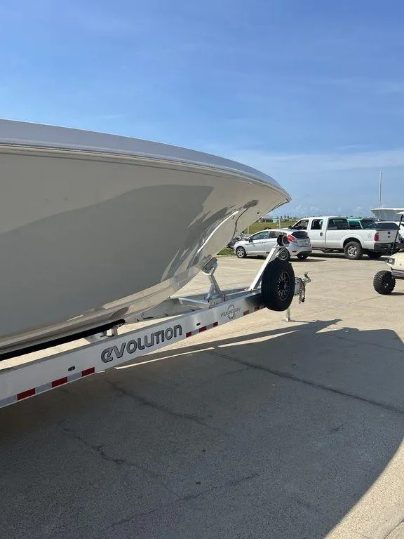 Slide: The Image of 2024 Fountain 38 TE boat on Evolution trailer, parked outdoors. - 13