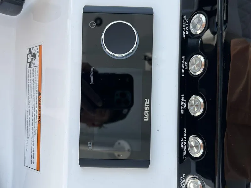 Slide: The Image of Control panel of a 2024 Fountain 38 TE boat with Fusion audio system. - 19