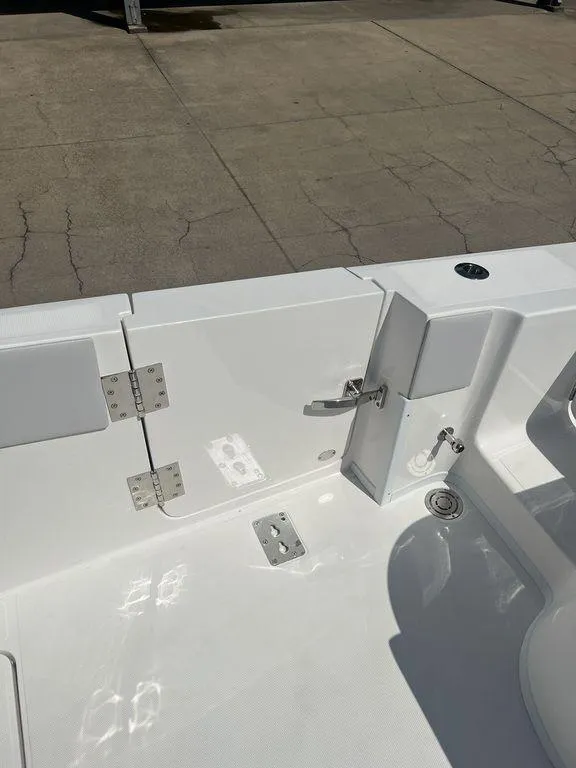 Slide: The Image of 2024 Fountain 38 TE boat deck, featuring sleek white design and stainless steel fittings. - 20