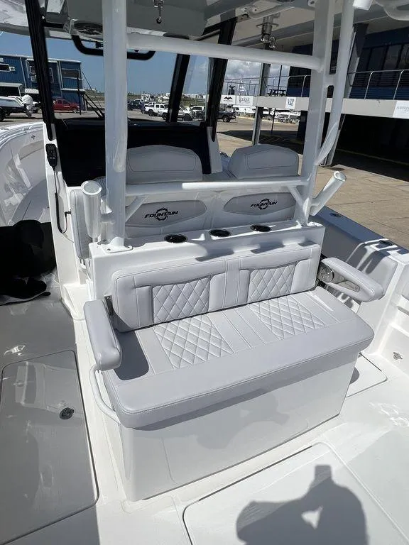 Slide: The Image of 2024 Fountain 38 TE boat interior with cushioned seating and modern design. - 24