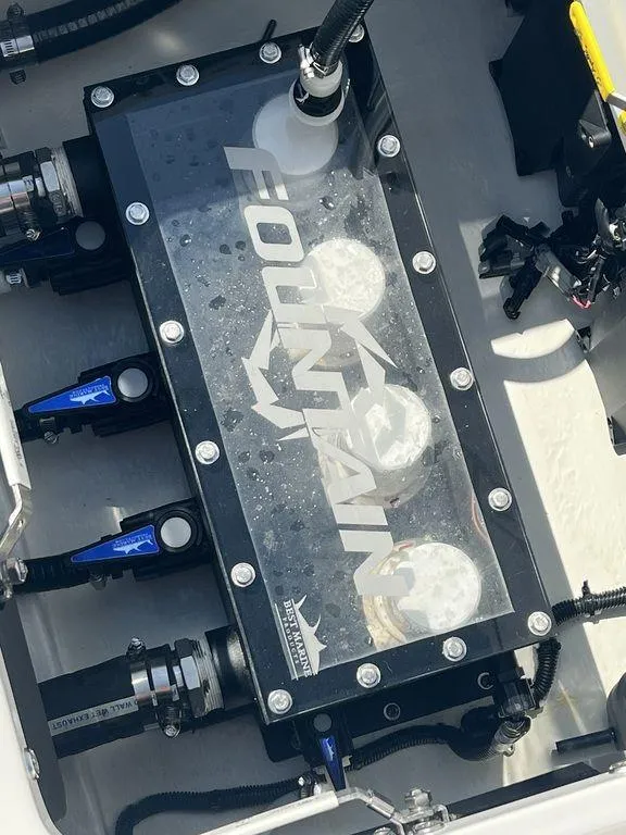 Slide: The Image of Engine compartment of 2024 Fountain 38 TE boat with visible components and branding. - 25