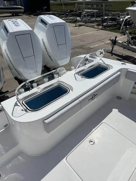 Slide: The Image of 2024 Fountain 38 TE boat with dual outboard motors and livewell compartments. - 26