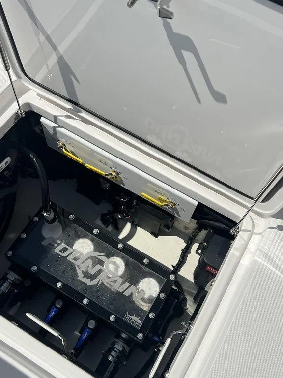 Slide: The Image of 2024 Fountain 38 TE boat engine compartment with visible components and branding. - 29