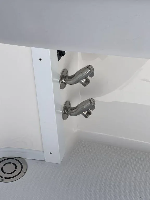 Slide: The Image of 2024 Fountain 38 TE boat interior with stainless steel fixtures and drain. - 30