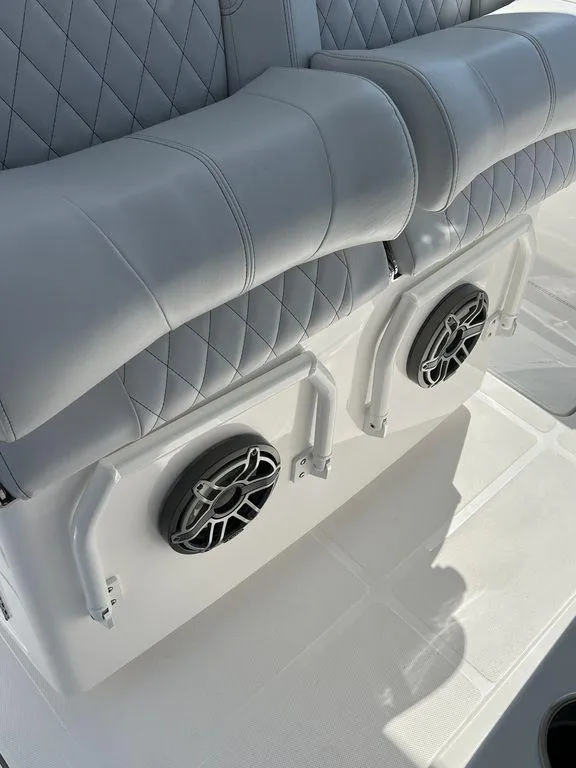 Slide: The Image of 2024 Fountain 38 TE boat seating with integrated speakers, featuring quilted upholstery. - 34