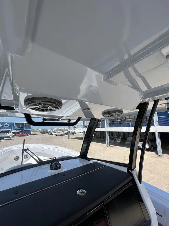 Slide: The Image of 2024 Fountain 38 TE boat interior with speakers and dashboard view. - 35