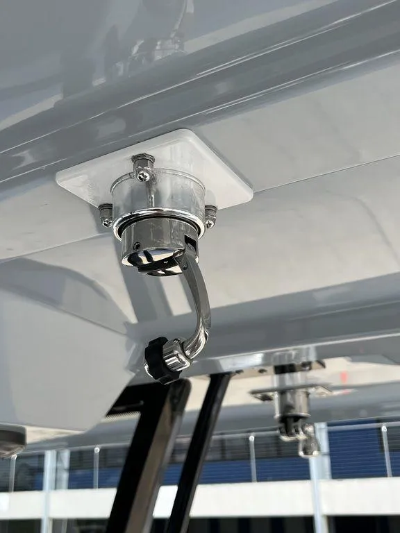 Slide: The Image of 2024 Fountain 38 TE boat detail showing mounted metal hook and fixture. - 38