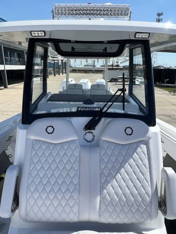 Slide: The Image of 2024 Fountain 38 TE boat with sleek design and diamond-stitched seating. - 45