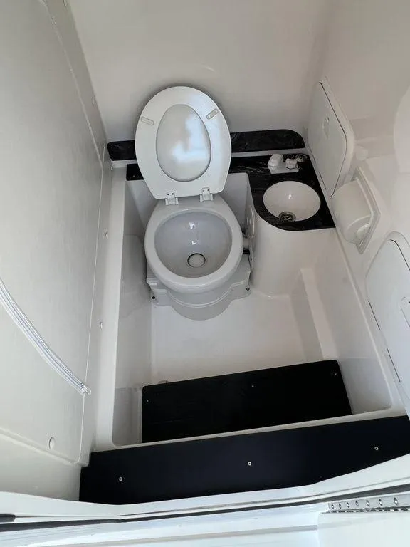 Slide: The Image of 2024 Fountain 38 TE boat bathroom with toilet and sink. - 48