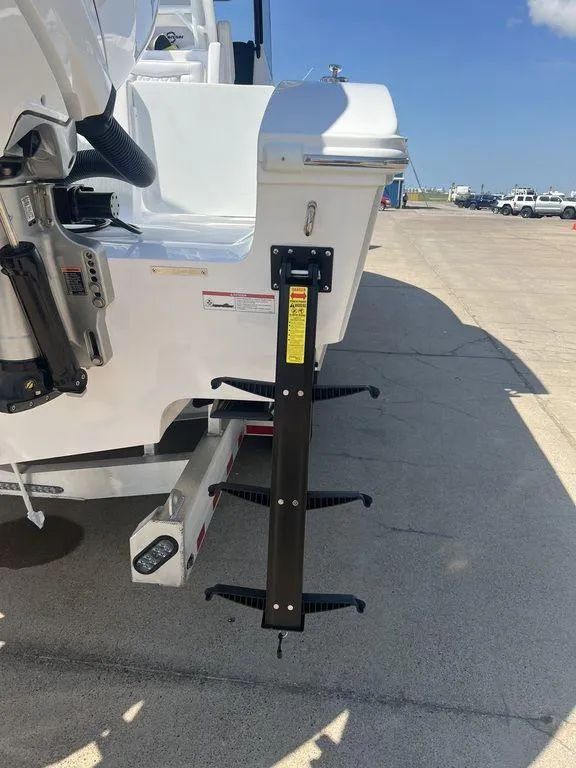 Slide: The Image of 2024 Fountain 38 TE boat ladder on a sunny day at the dock. - 7