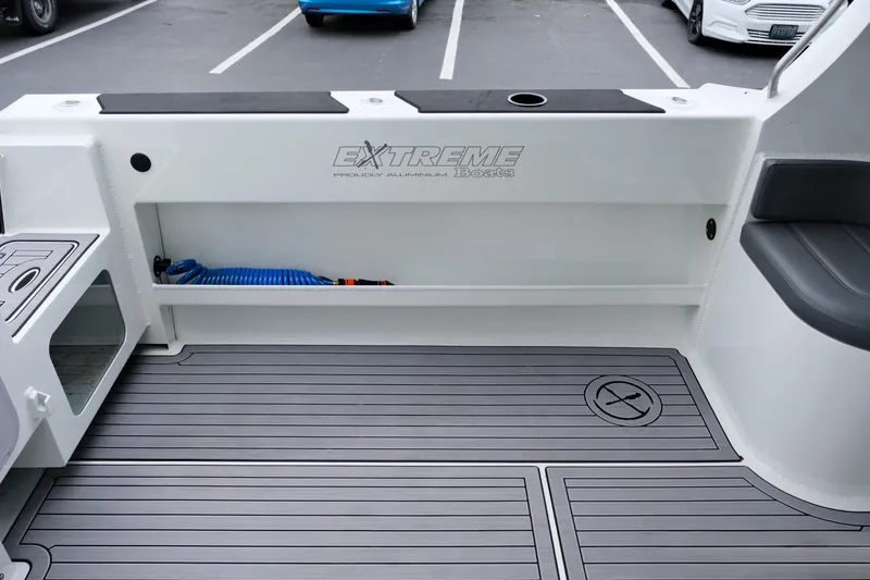Slide: The Image of 2023 Extreme Boats 745 Game King interior with sleek deck and storage. - 10
