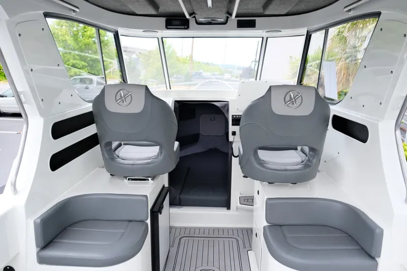 Slide: The Image of Interior of 2023 Extreme Boats 745 Game King, featuring modern seating and dashboard. - 12