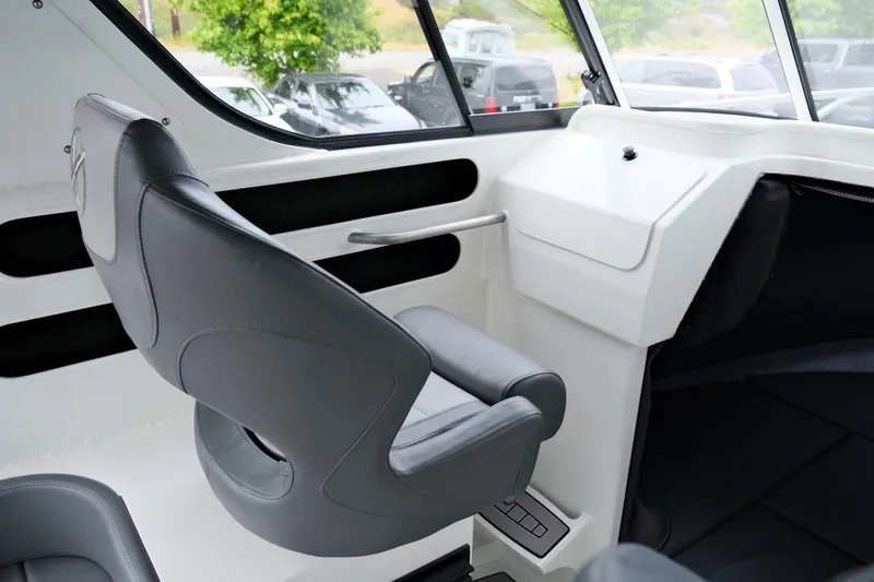 Slide: The Image of Interior of 2023 Extreme Boats 745 Game King, featuring a sleek captain's chair. - 16