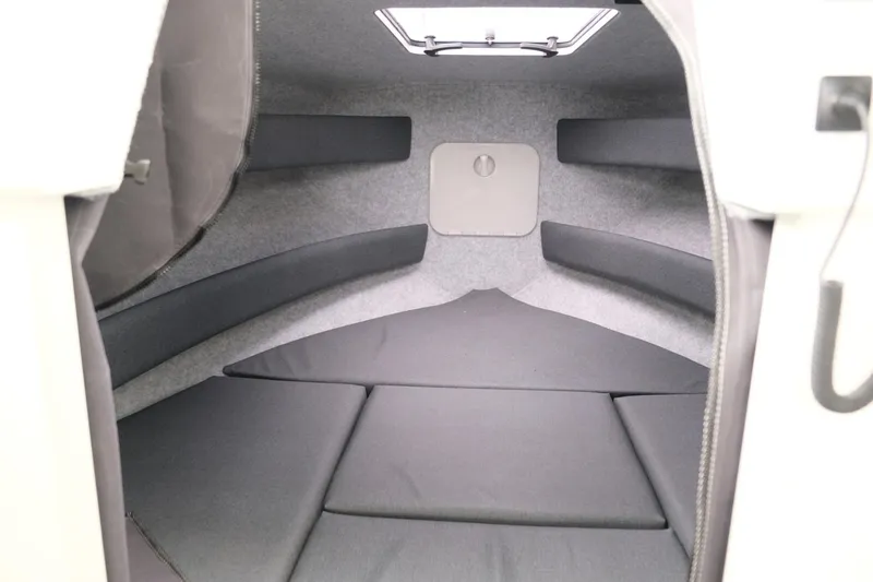 Slide: The Image of 2023 Extreme Boats 745 Game King cabin interior with cushioned seating. - 17