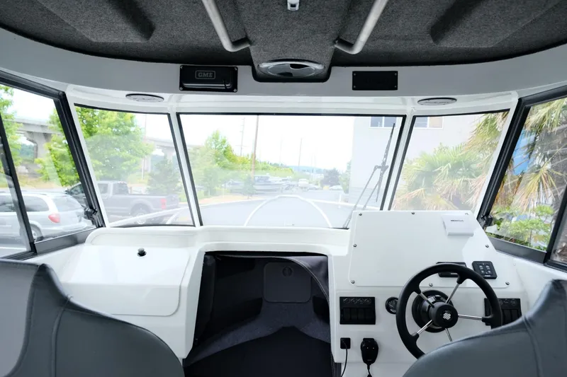 Slide: The Image of Interior view of 2023 Extreme Boats 745 Game King helm with steering wheel and dashboard. - 18