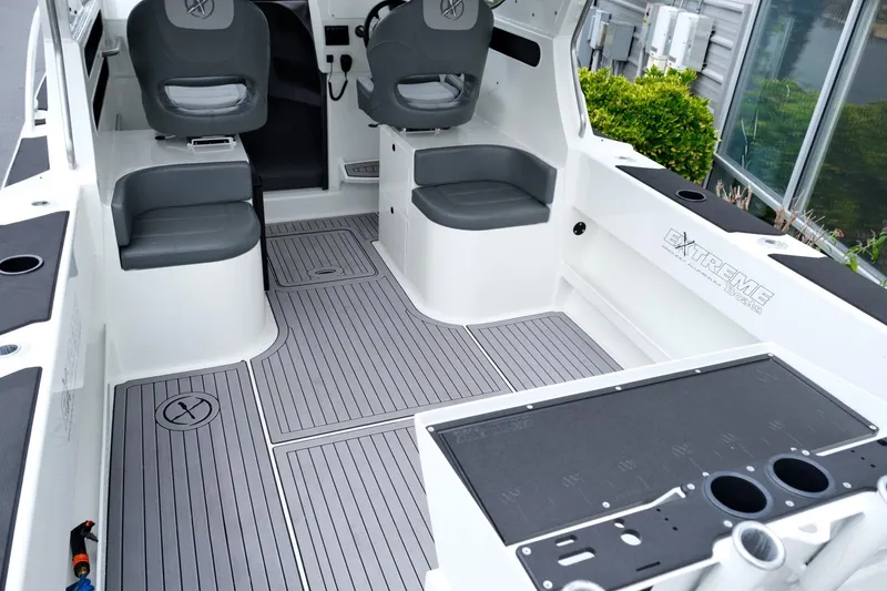 Slide: The Image of 2023 Extreme Boats 745 Game King interior with seating and fishing setup. - 8