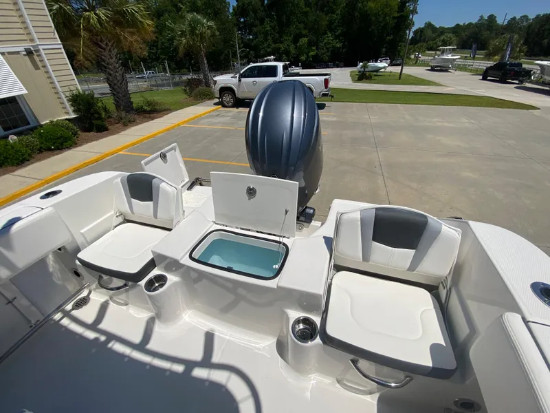 Slide: The Image of 2026 Robalo R200 Center Console boat interior with seating and storage compartments. - 7