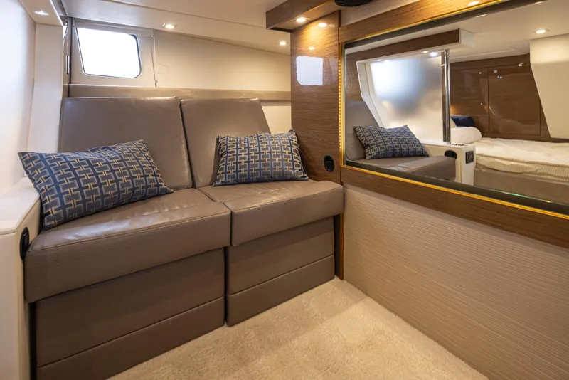Slide: The Image of 2018 Cruisers Yachts 45 Cantius interior with leather seating and decorative pillows. - 19