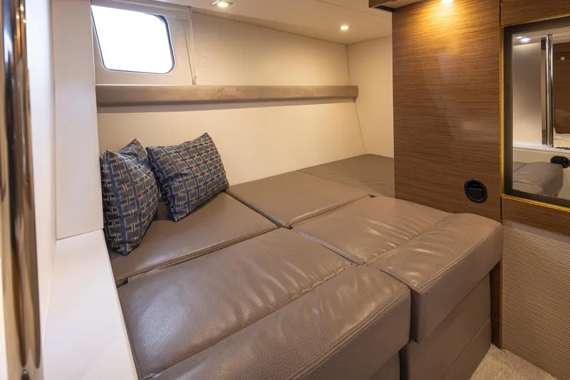Slide: The Image of 2018 Cruisers Yachts 45 Cantius interior cabin with bed and pillows. - 20
