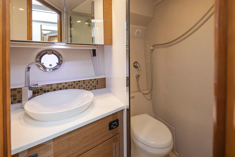 Slide: The Image of Modern bathroom in 2018 Cruisers Yachts 45 Cantius with vessel sink and shower. - 23