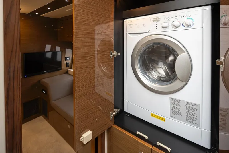 Slide: The Image of 2018 Cruisers Yachts 45 Cantius interior with washer and dryer unit. - 24