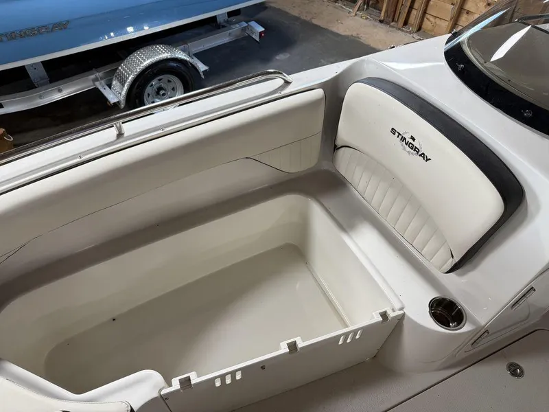 Slide: The Image of 2024 Stingray 192SC boat interior with seating and storage compartment. - 28