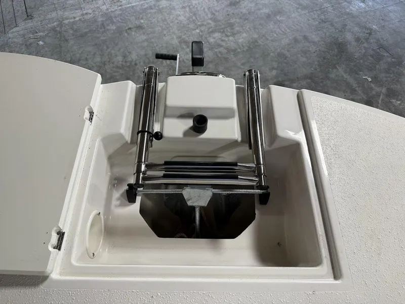 Slide: The Image of 2024 Stingray 192SC boat anchor compartment with stainless steel fittings and hatch. - 30
