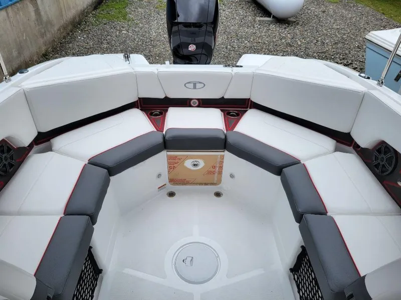 Slide: The Image of 2024 Tahoe 210 S boat interior with white and gray seating. - 8