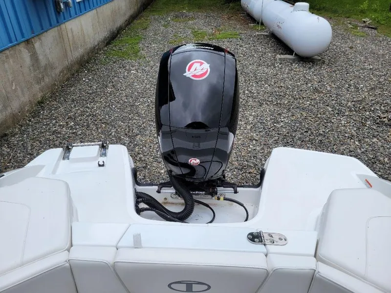 Slide: The Image of 2024 Tahoe 210 S boat with Mercury outboard motor, rear view. - 9