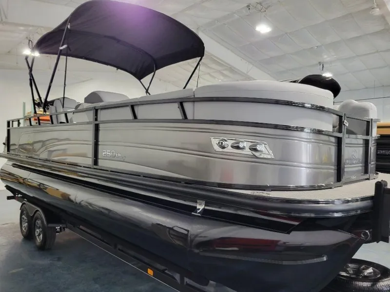 Slide: The Image of 2024 Regency 250 DL3 pontoon boat in showroom. - 7