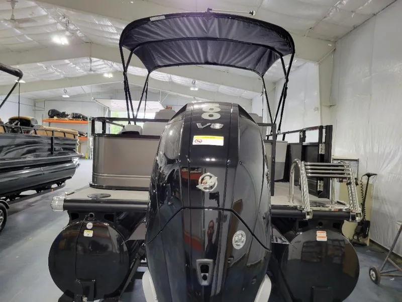 Slide: The Image of 2024 Regency 250 DL3 pontoon boat with V8 engine in a showroom. - 8