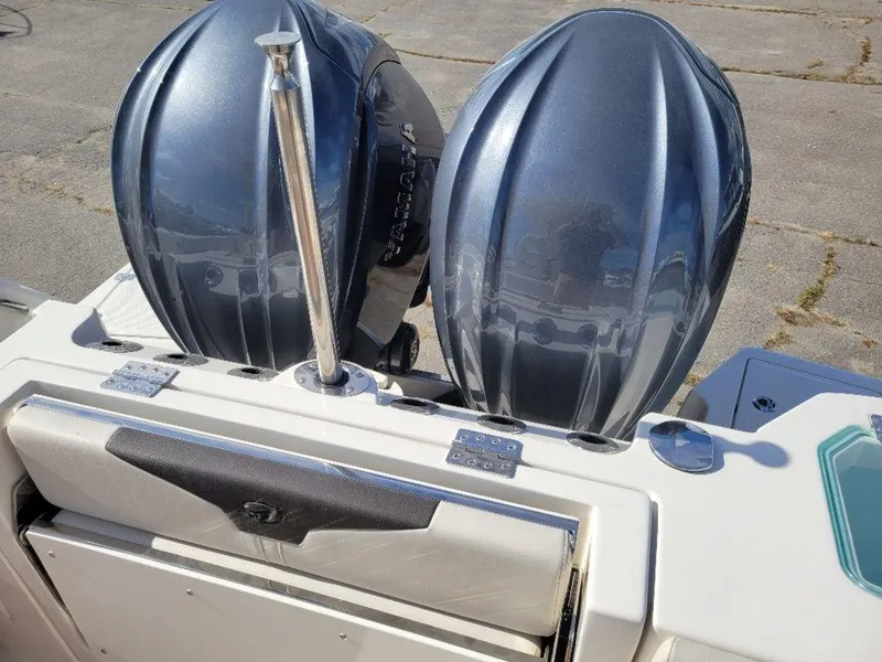 Slide: The Image of 2024 Sailfish 272 CC boat with dual outboard engines. - 12