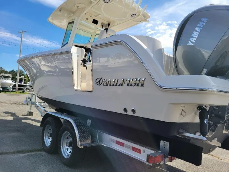 Slide: The Image of 2024 Sailfish 272 CC boat on a trailer with Yamaha outboard motor. - 15
