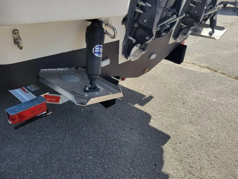 Slide: The Image of 2024 Sailfish 272 CC boat rear view showing trim tab and hydraulic system. - 16