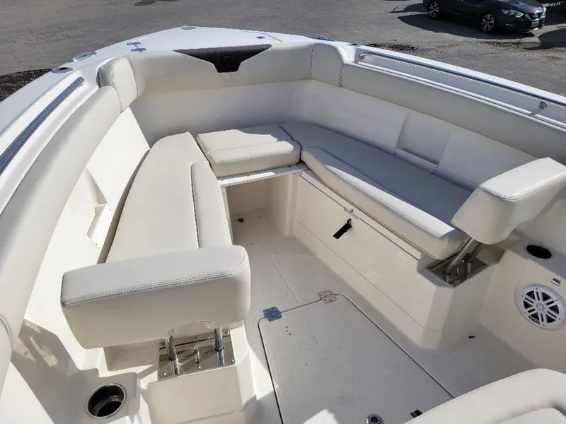 Slide: The Image of 2024 Sailfish 272 CC boat interior with white cushioned seating. - 4