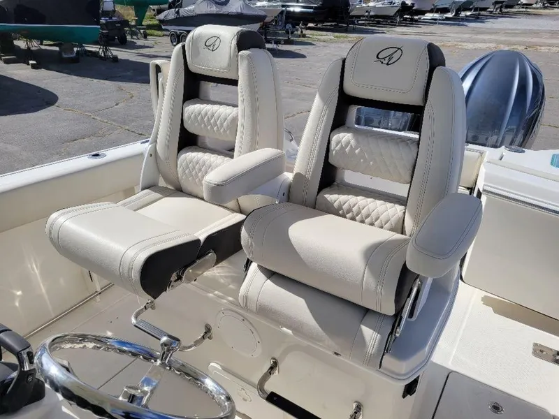 Slide: The Image of 2024 Sailfish 272 CC boat with luxurious dual captain's chairs. - 8