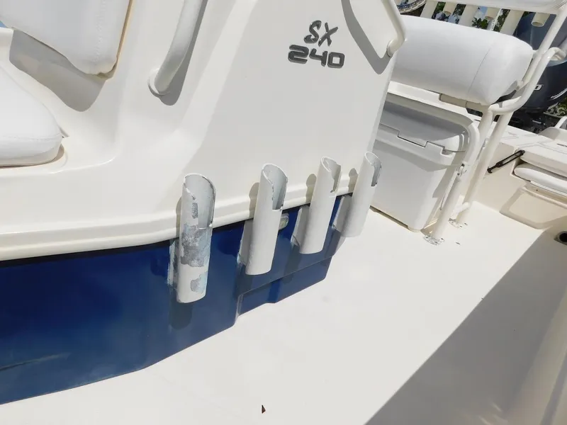 Slide: The Image of Skeeter 240SX 2016 boat interior with rod holders and seating. - 16